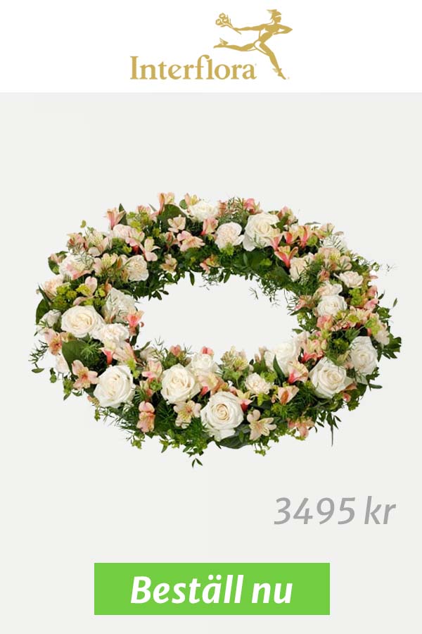 Vacker blomsterkrans med vita och rosa blommor